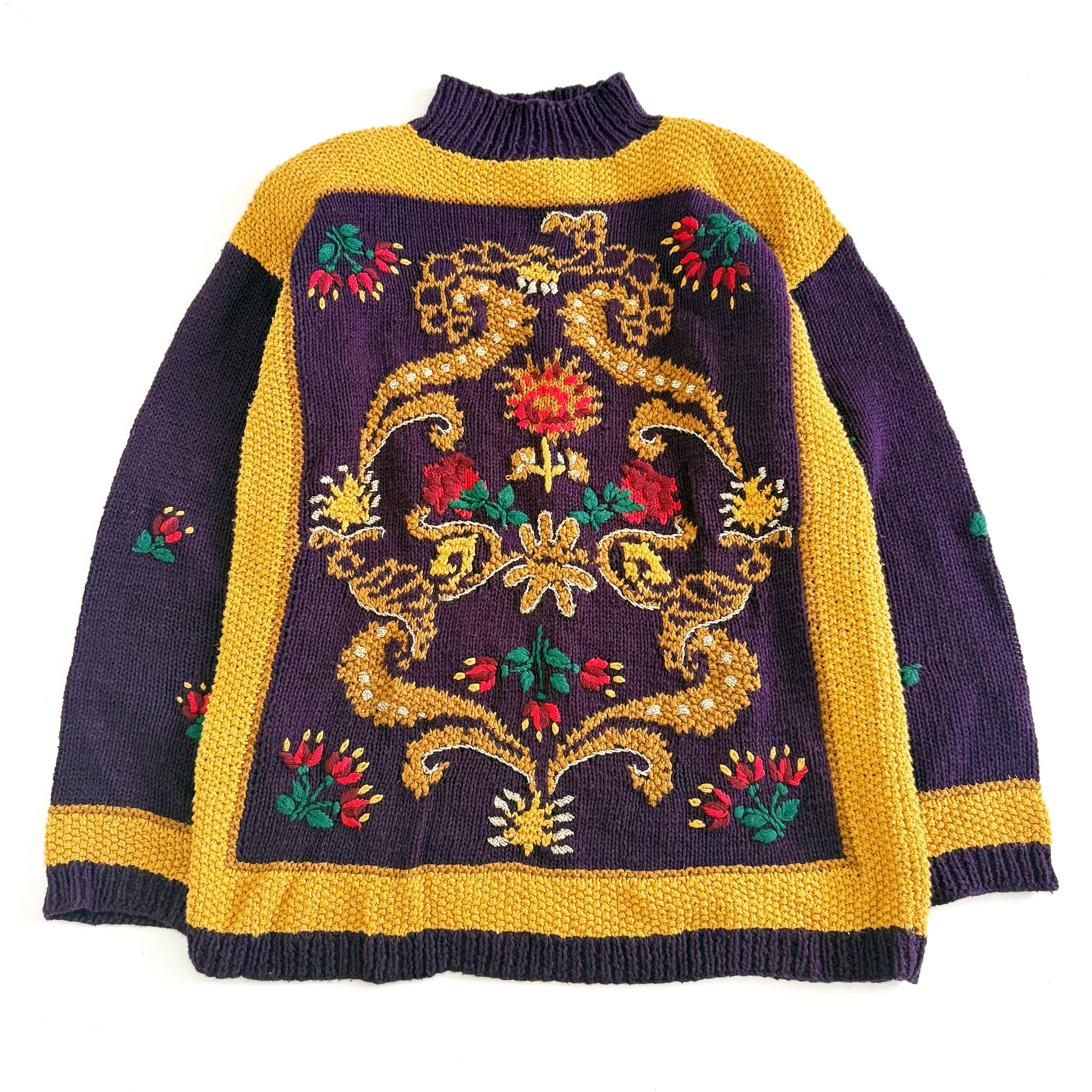 A vintage knitted sweater with a floral textured design in purple and yellow colors