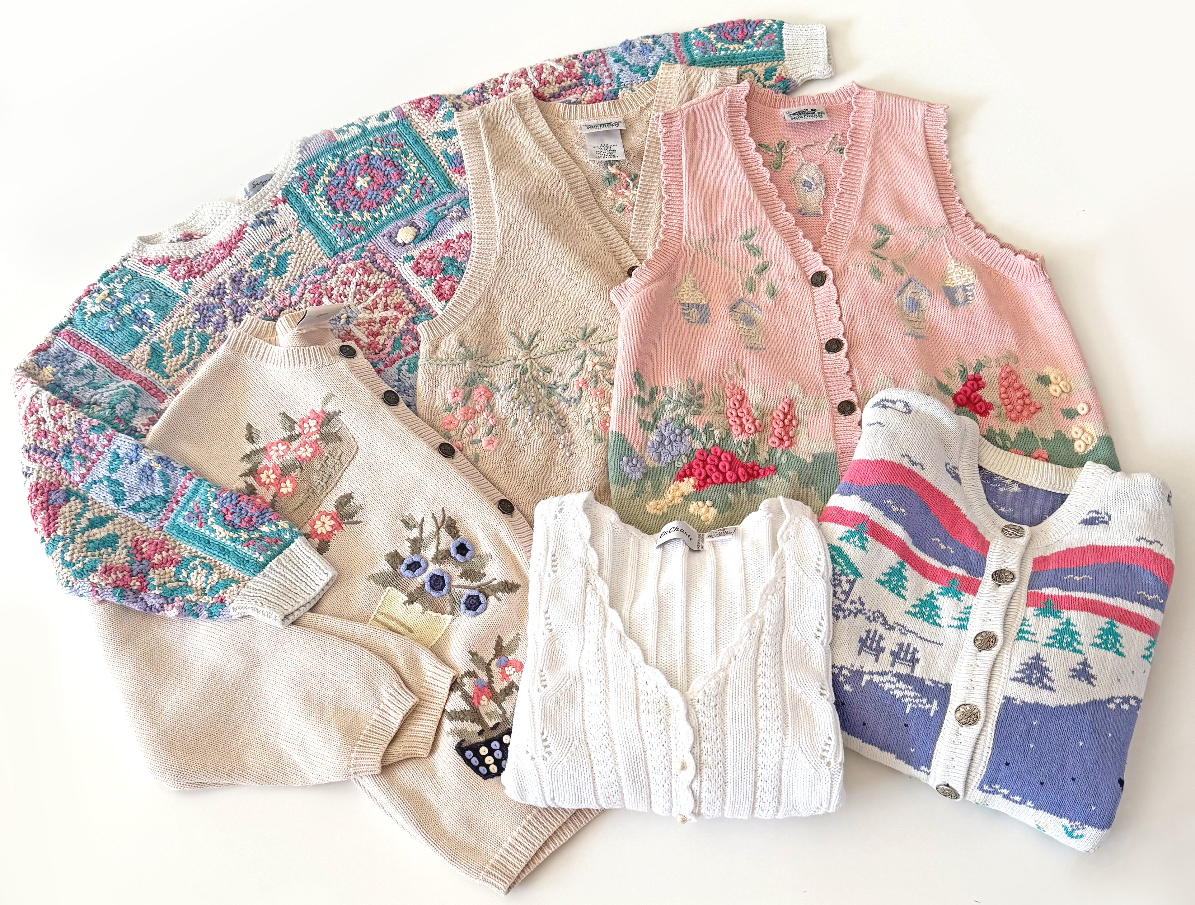 Flat lay of spring themed clothing, in pastel colours. 