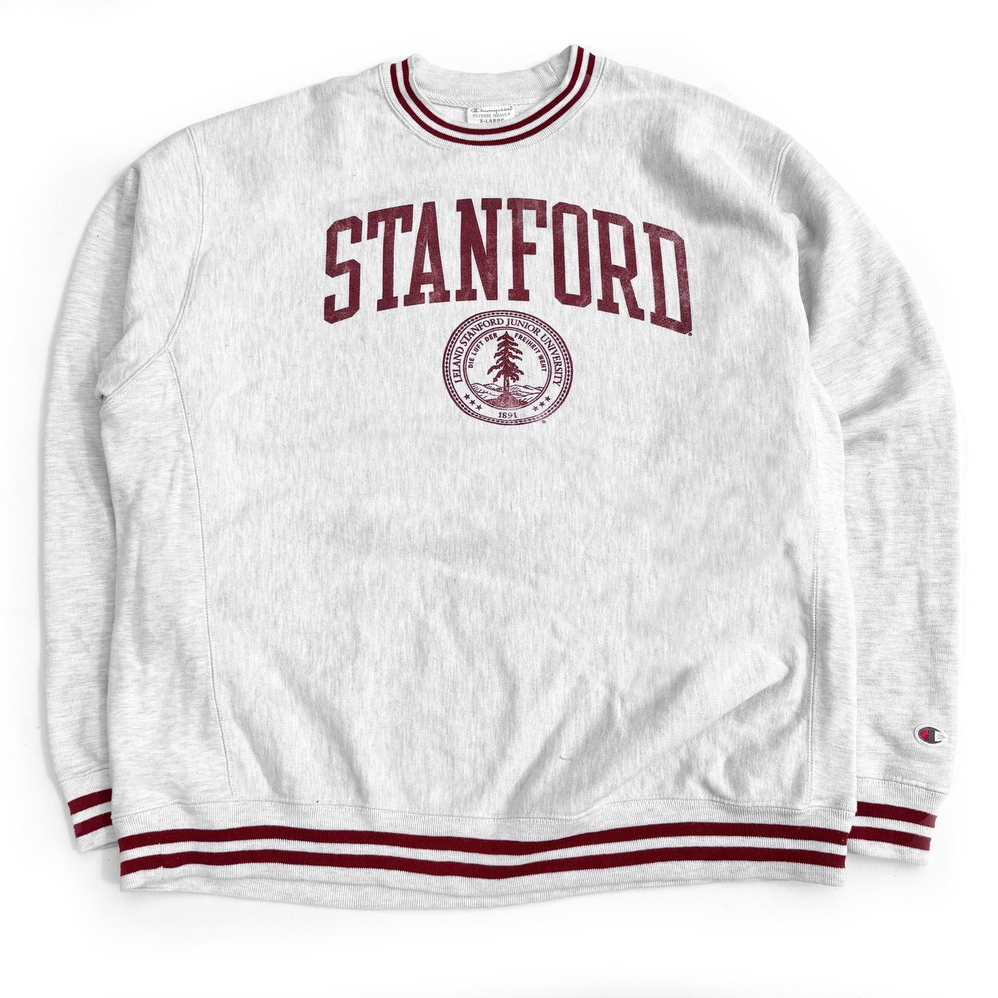 A gray Champion sweatshirt with 'STANFORD' written across the front in red, along with the Stanford University logo, with a small stain on one sleeve.